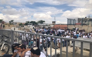 Israeli settler youth mobs gather on one of the roofs in the Old City of Jerusalem, Al-Haq (C) 13 May 2018.