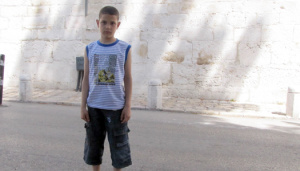 Palestinian Child Knocked Down and Physically Assaulted by an Israeli