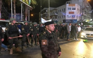 Palestinian security forces gather in front of Al-Manara Square, 13 June 2018.