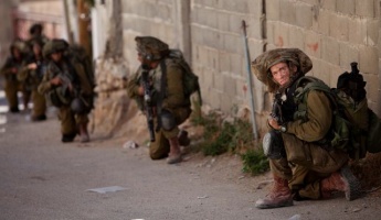Israeli soldiers take their positions during a military operation searching for three missing Israeli teenagers, near the West Bank city of Hebron, June 15, 2014.AP 2264894783
